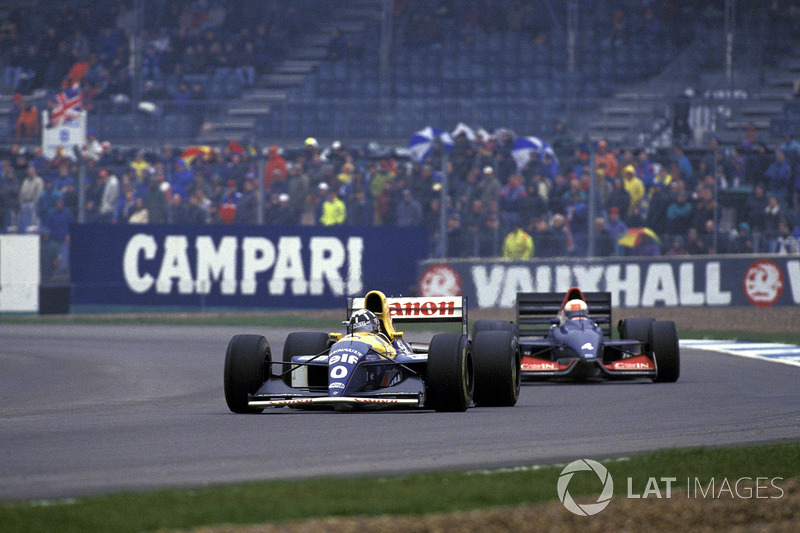 Damon Hill, Williams FW15C, leads Andrea de Cesaris, Tyrrell 020C