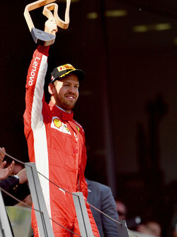 Sebastian Vettel, Ferrari celebrates with the trophy on the podium