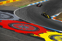 Carlos Sainz Jr., Renault Sport F1 Team R.S. 18, leads Kevin Magnussen, Haas F1 Team VF-18