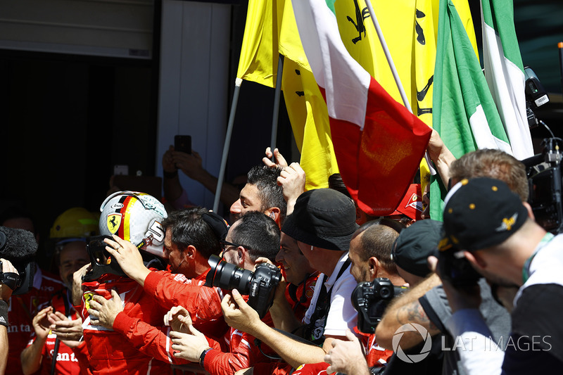 Sebastian Vettel, Ferrari SF70H, celebrates with his team after winning the race
