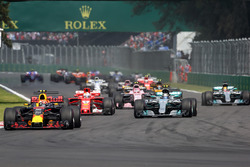 Max Verstappen, Red Bull Racing RB13 leads at the start of the race with Lewis Hamilton, Mercedes-Benz F1 W08 and rear puncture after colliding with Sebastian Vettel, Ferrari SF70H