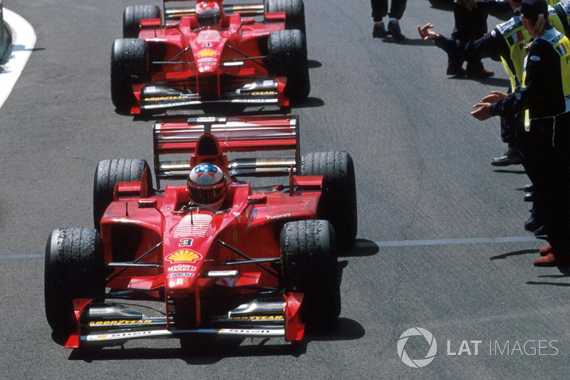 Race winner Michael Schumacher, Ferrari, second place Eddie Irvine, Ferrari