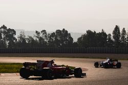 Sebastian Vettel, Ferrari SF70H, follows Carlos Sainz Jr., Toro Rosso STR12