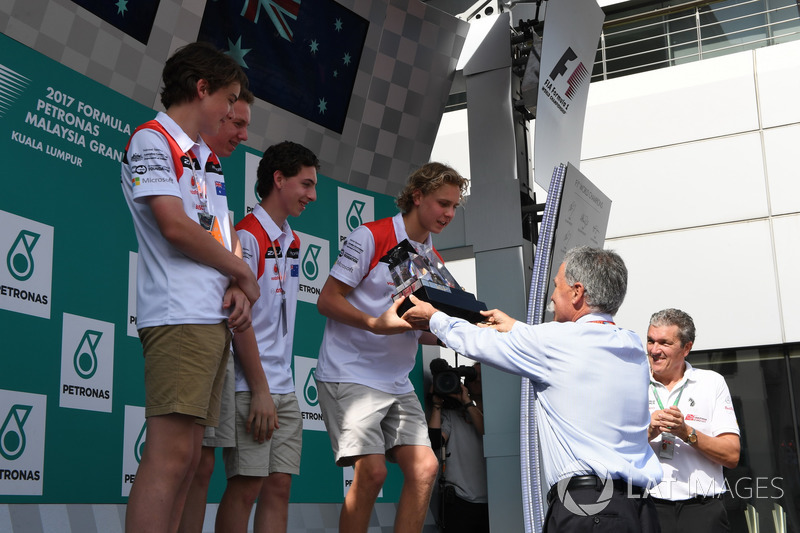 F1 in Schools students on the podium, Chase Carey, Chief Executive Officer and Executive Chairman of