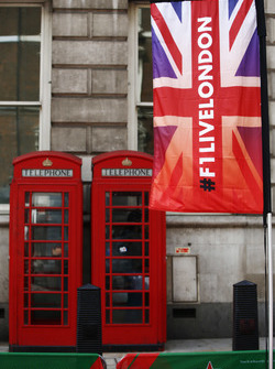 F1 Live London flags alongside traditional British Red Telephone Boxes