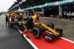 The car of Jolyon Palmer, Renault Sport F1 Team RS17 is pushed by mechanics in pitlane