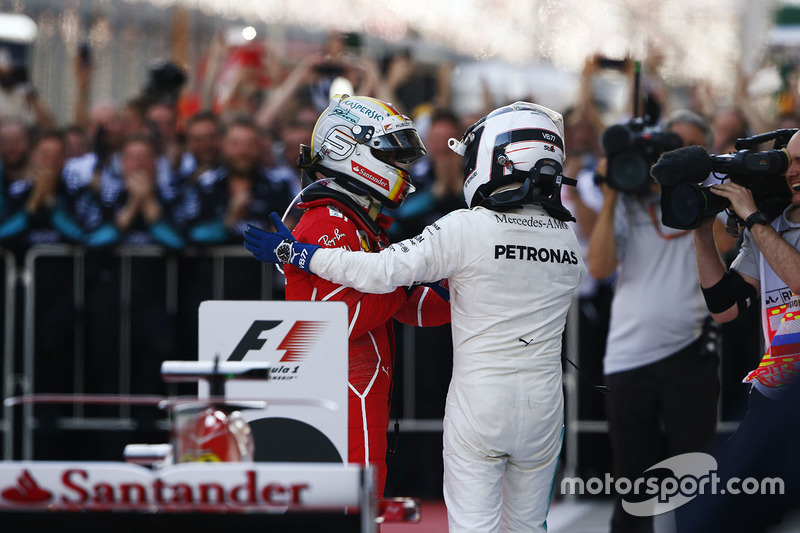 Second place Sebastian Vettel, Ferrari, race winner Valtteri Bottas, Mercedes AMG F1