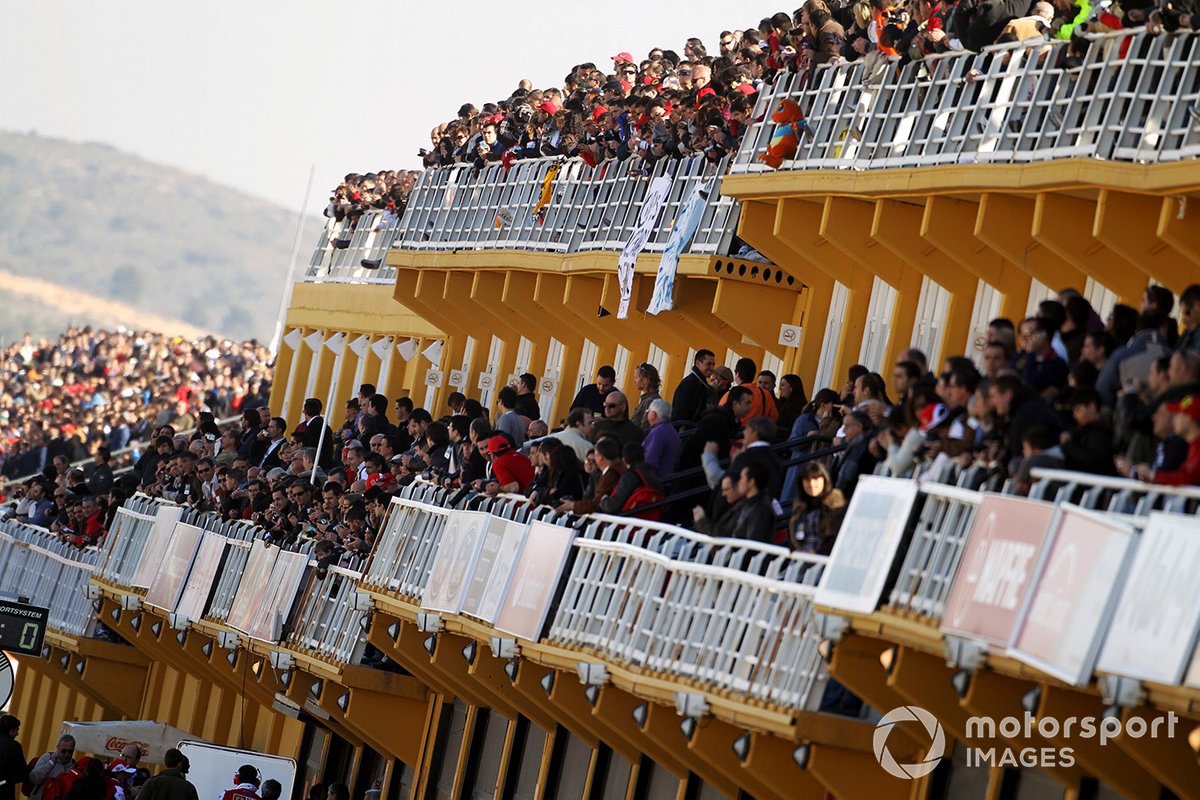 Fans flock into the grandstands to see Fernando Alonso test the Ferrari for the first time