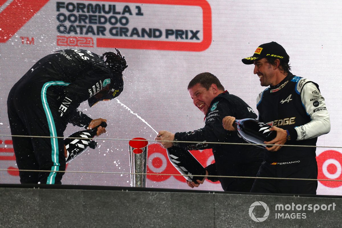 The Mercedes trophy delegate and Fernando Alonso, Alpine F1, 3rd position, spray Lewis Hamilton, Mercedes, 1st position, with Rose Water on the podium