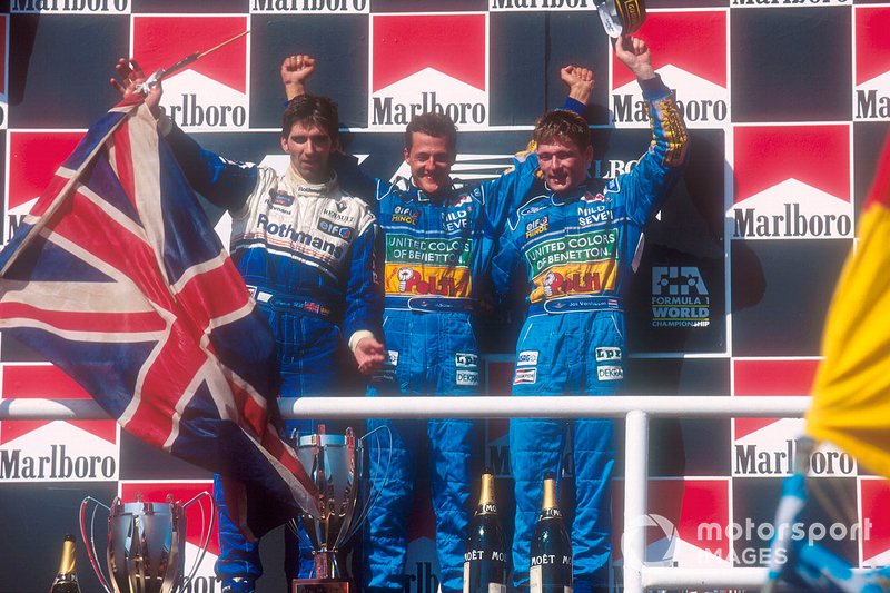 Podium: race winner Michael Schumacher, Benetton, second place Damon Hill, third place Jos Verstappen, Benetton