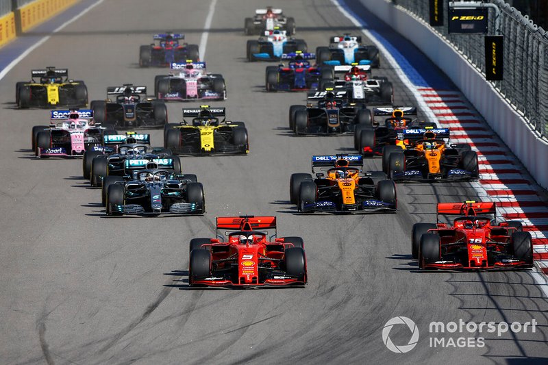 Sebastian Vettel, Ferrari SF90, leads Charles Leclerc, Ferrari SF90, Lewis Hamilton, Mercedes AMG F1 W10, Carlos Sainz Jr., McLaren MCL34, Valtteri Bottas, Mercedes AMG W10, and the rest of the field at the start of the race