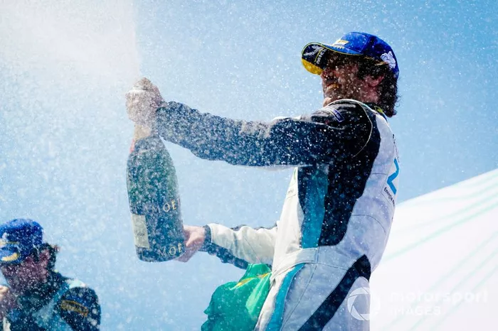 Race winner Sérgio Jimenez, Jaguar Brazil Racing celebrates with the champagne on the podium
