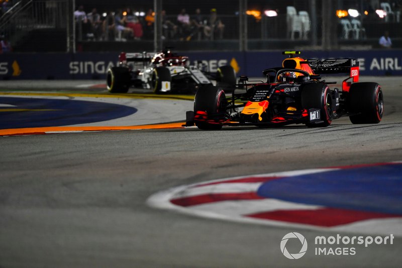 Alexander Albon, Red Bull Racing RB15, leads Kimi Raikkonen, Alfa Romeo Racing C38