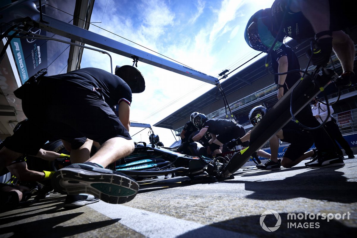 Mercedes mechanics during pit stop practice