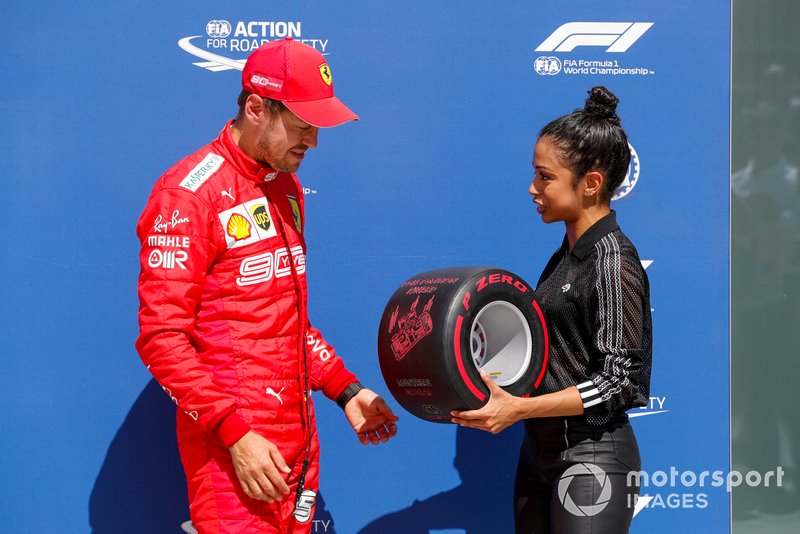Sebastian Vettel, Ferrari, is presented with his Pirelli Pole Position Award by actress Liza Koshy