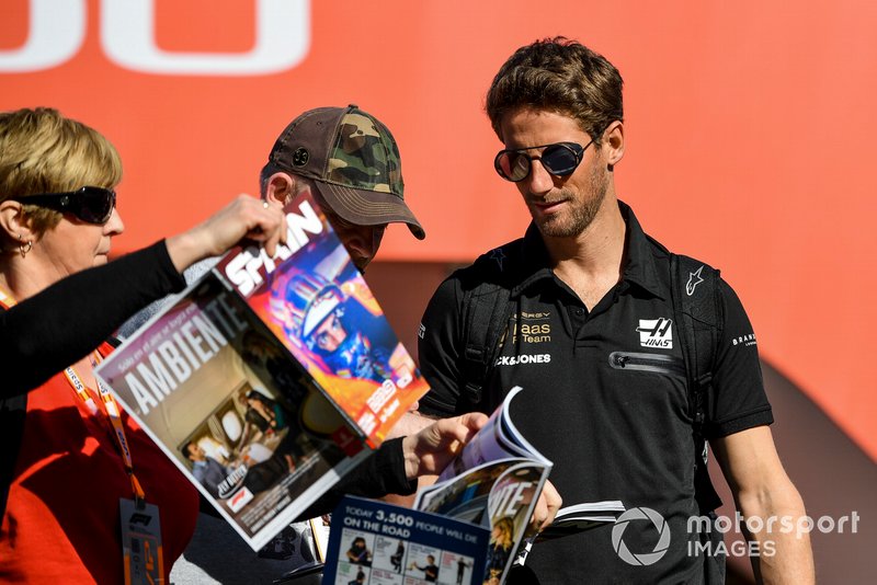 Romain Grosjean, Haas F1 signs an autograph for a fan