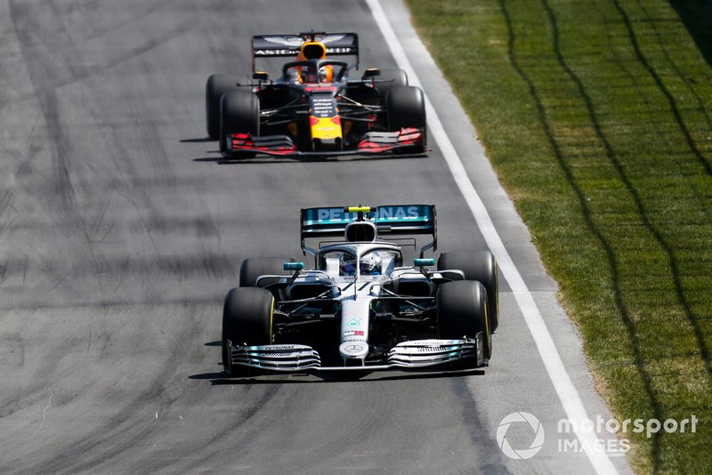 Valtteri Bottas, Mercedes AMG W10, leads Max Verstappen, Red Bull Racing RB15