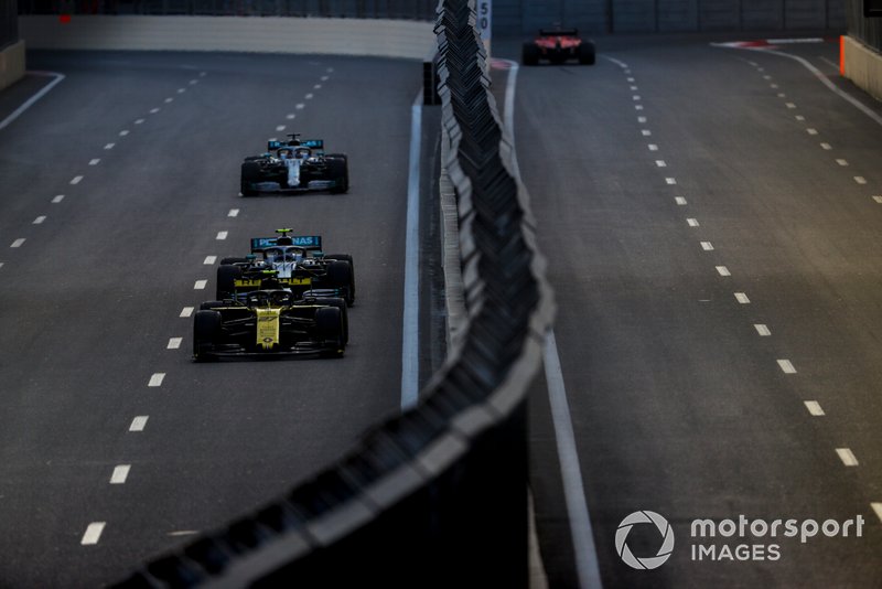 Nico Hulkenberg, Renault R.S. 19, leads Valtteri Bottas, Mercedes AMG W10, and Lewis Hamilton, Mercedes AMG F1 W10