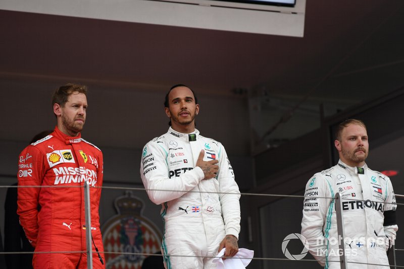 Sebastian Vettel, Ferrari, 2nd position, Lewis Hamilton, Mercedes AMG F1, 1st position, and Valtteri Bottas, Mercedes AMG F1, 3rd position, on the podium