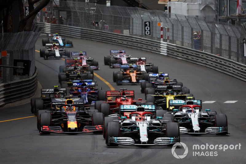 Lewis Hamilton, Mercedes AMG F1 W10, leads Valtteri Bottas, Mercedes AMG W10, Max Verstappen, Red Bull Racing RB15, Sebastian Vettel, Ferrari SF90, Daniel Ricciardo, Renault R.S.19, Kevin Magnussen, Haas F1 Team VF-19, and the rest of the field at the start