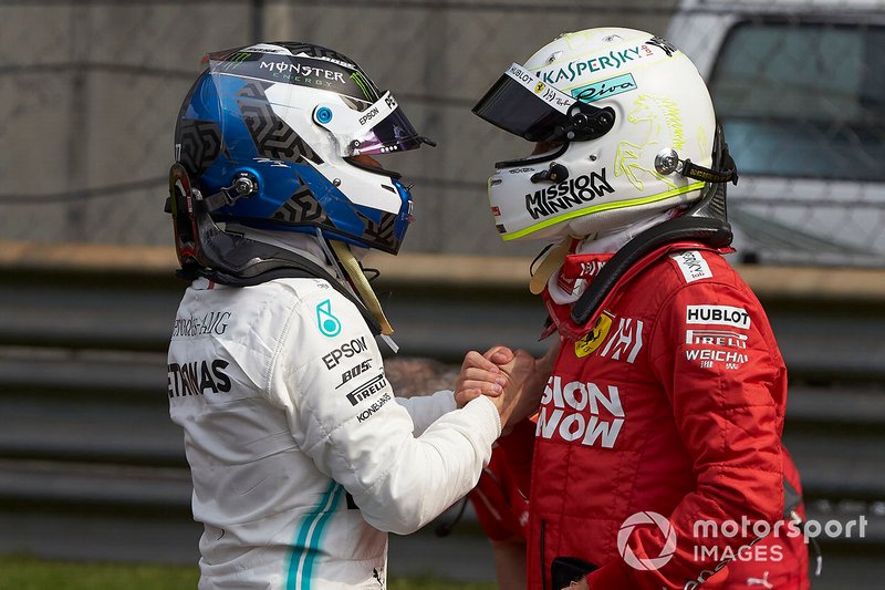 Sebastian Vettel, Ferrari, congratulates pole man Valtteri Bottas, Mercedes AMG F1