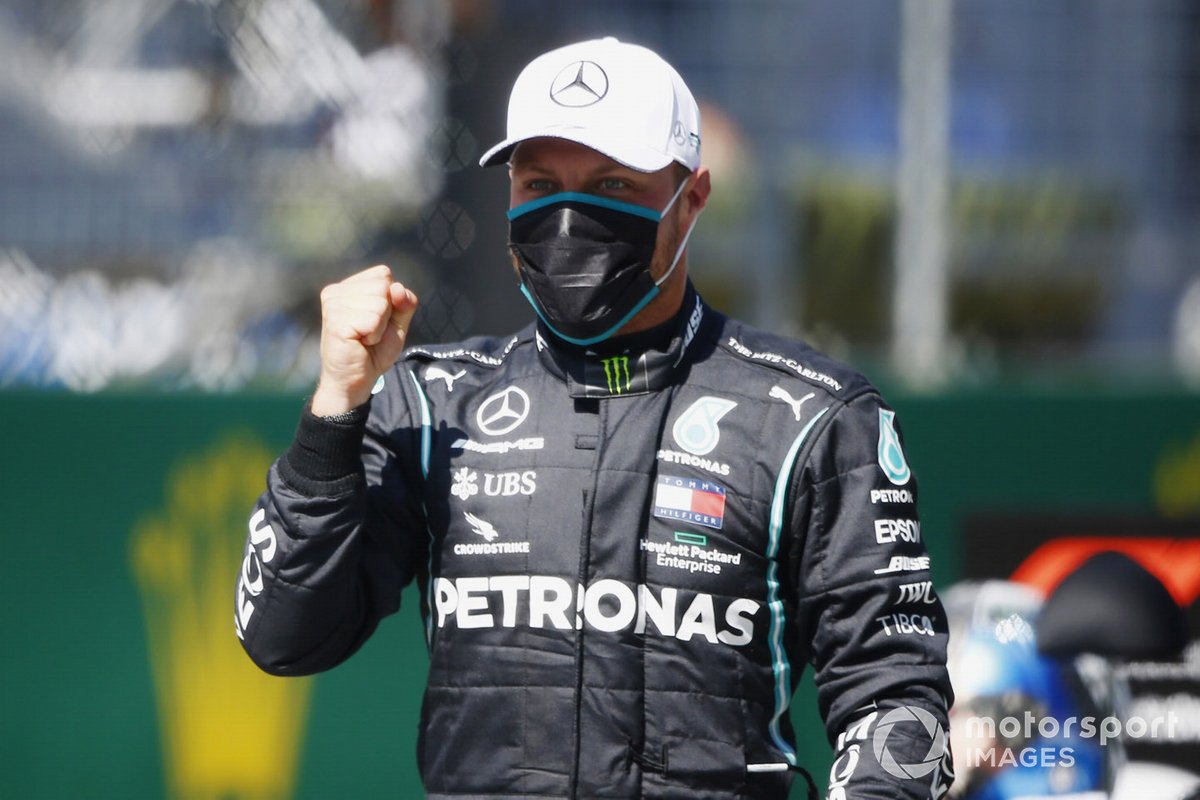 Valtteri Bottas, Mercedes F1 W11 EQ Performance, celebrates after taking Pole Position