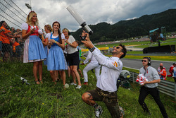 Daniel Ricciardo, Red Bull Racing fires a T-Shirt into the crowd of fans, a T-Shirt gun on the drive