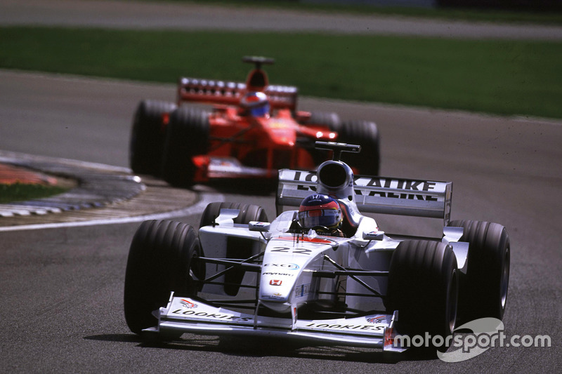 Jacques Villeneuve, BAR leads Michael Schumacher, Ferrari