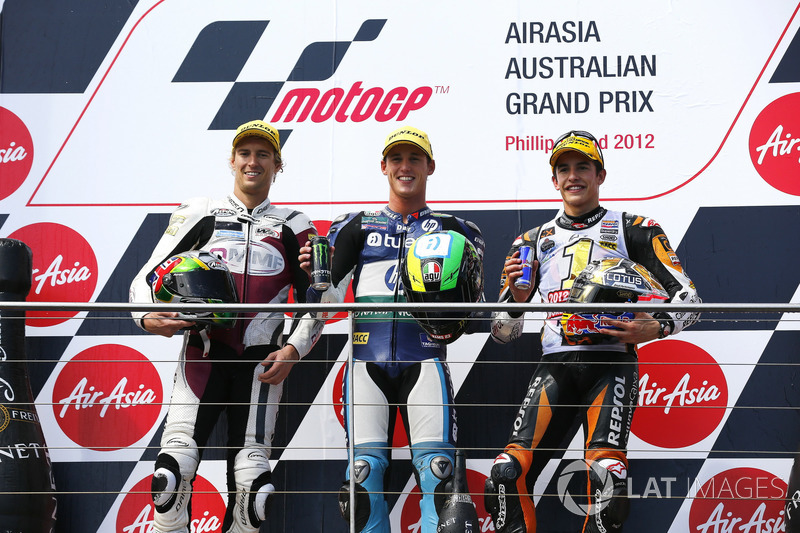 Podium: second place Anthony West, Race winner Pol Espargaro, third place Marc Marquez