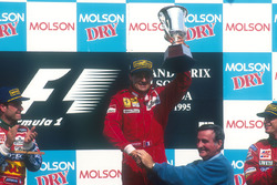 Podium: race winner Jean Alesi, Ferrari, second place Rubens Barrichello, Jordan, third place Eddie Irvine, Jordan, Pierre Bourque, Mayor of Montreal
