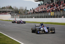 Pascal Wehrlein, Sauber C36, leads Carlos Sainz Jr., Scuderia Toro Rosso STR12 and Romain Grosjean,