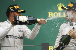 Lewis Hamilton, Mercedes AMG F1 sprays champagne over team-mate Nico Rosberg, Mercedes AMG F1 on the