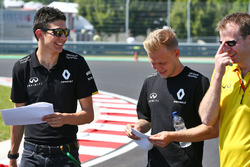 Esteban Ocon, Renault Sport F1 Team Test Driver and Kevin Magnussen, Renault Sport F1 Team walk the