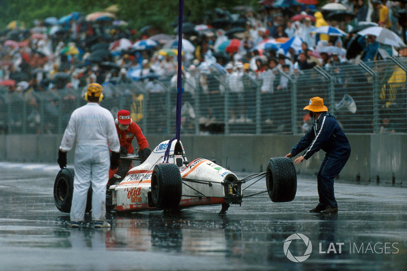 Piercarlo Ghinzani's, Osella FA1-M89 is removed after a shunt with Nelson Piquet,