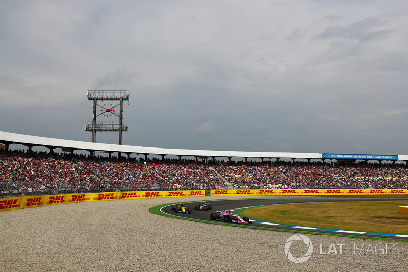 Esteban Ocon, Force India VJM11, leads Carlos Sainz Jr., Renault Sport F1 Team R.S. 18, and Kevin Magnussen, Haas F1 Team VF-18