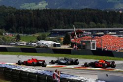 Lewis Hamilton, Mercedes-AMG F1 W09 and Kimi Raikkonen, Ferrari SF71H battle and Max Verstappen, Red Bull Racing RB14 at the start of the race