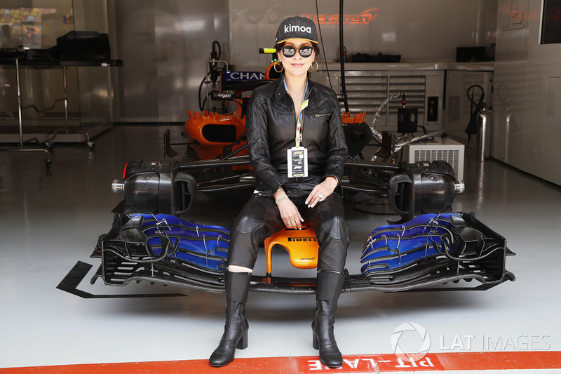 Chinese actress Carina Lau poses with a McLaren