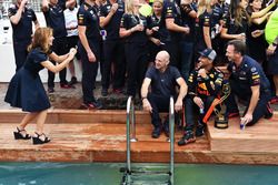 Geri Halliwell, takes a photo of Daniel Ricciardo, Red Bull Racing, Adrian Newey, Red Bull Racing at the Red Bull Racing Energy Station swimming pool