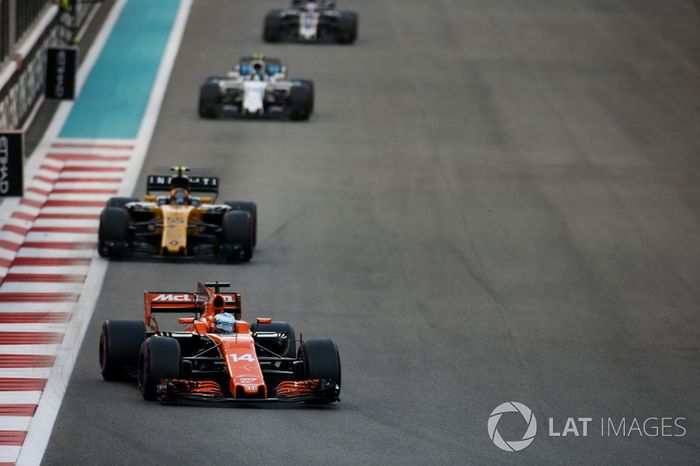Fernando Alonso, McLaren MCL32, leads Carlos Sainz Jr., Renault F1 Team RS17, and Lance Stroll, Williams FW40