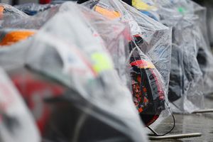 Bikes are covered as rain falls