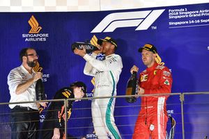 Max Verstappen, Red Bull Racing, Lewis Hamilton, Mercedes AMG F1 and Sebastian Vettel, Ferrari celebrate on the podium with the champagne 