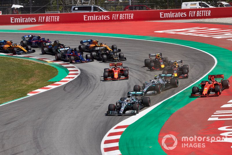 Lewis Hamilton, Mercedes AMG F1 W10, leads Valtteri Bottas, Mercedes AMG W10, Sebastian Vettel, Ferrari SF90,Max Verstappen, Red Bull Racing RB15, Charles Leclerc, Ferrari SF90, and the rest of the field in the first corner