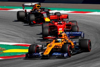Lando Norris, McLaren MCL34 leads Sebastian Vettel, Ferrari SF90 and Max Verstappen, Red Bull Racing RB15