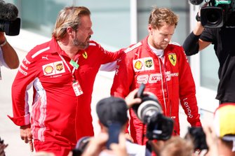 An upset Sebastian Vettel, Ferrari, 2nd position, returns for the podium ceremony
