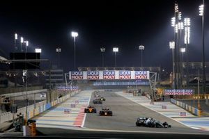 Valtteri Bottas, Mercedes AMG W10, leads Max Verstappen, Red Bull Racing RB15, and Carlos Sainz Jr., McLaren MCL34