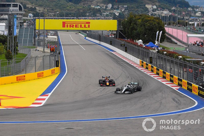 Valtteri Bottas, Mercedes AMG W10, leads Max Verstappen, Red Bull Racing RB15