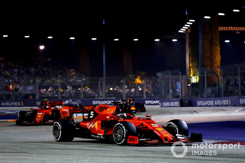 Sebastian Vettel, Ferrari SF90, leads Charles Leclerc, Ferrari SF90