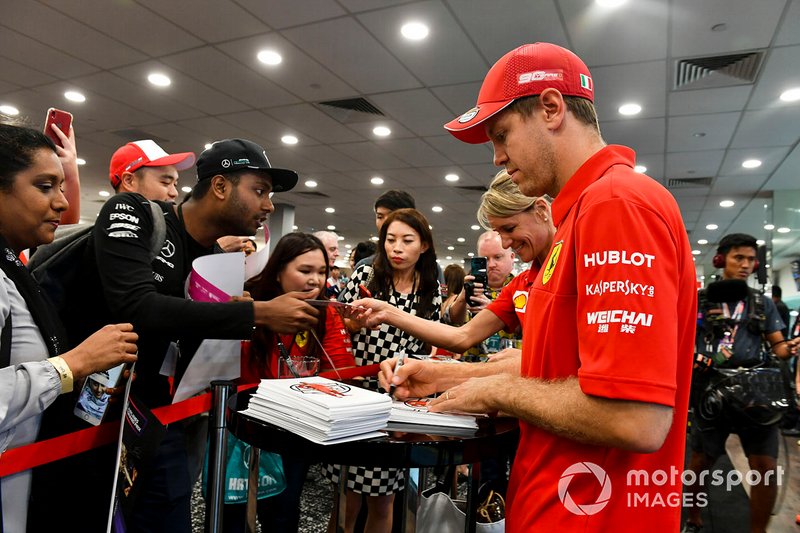 Sebastian Vettel, Ferrari signs an autograph for a fan 