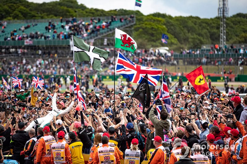 Race winner Lewis Hamilton, Mercedes AMG F1 celebrates with fans by crowd surfing