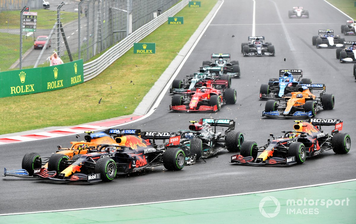 Valtteri Bottas, Mercedes W12, collides with Lando Norris, McLaren MCL35M, and Max Verstappen, Red Bull Racing RB16B, at the start